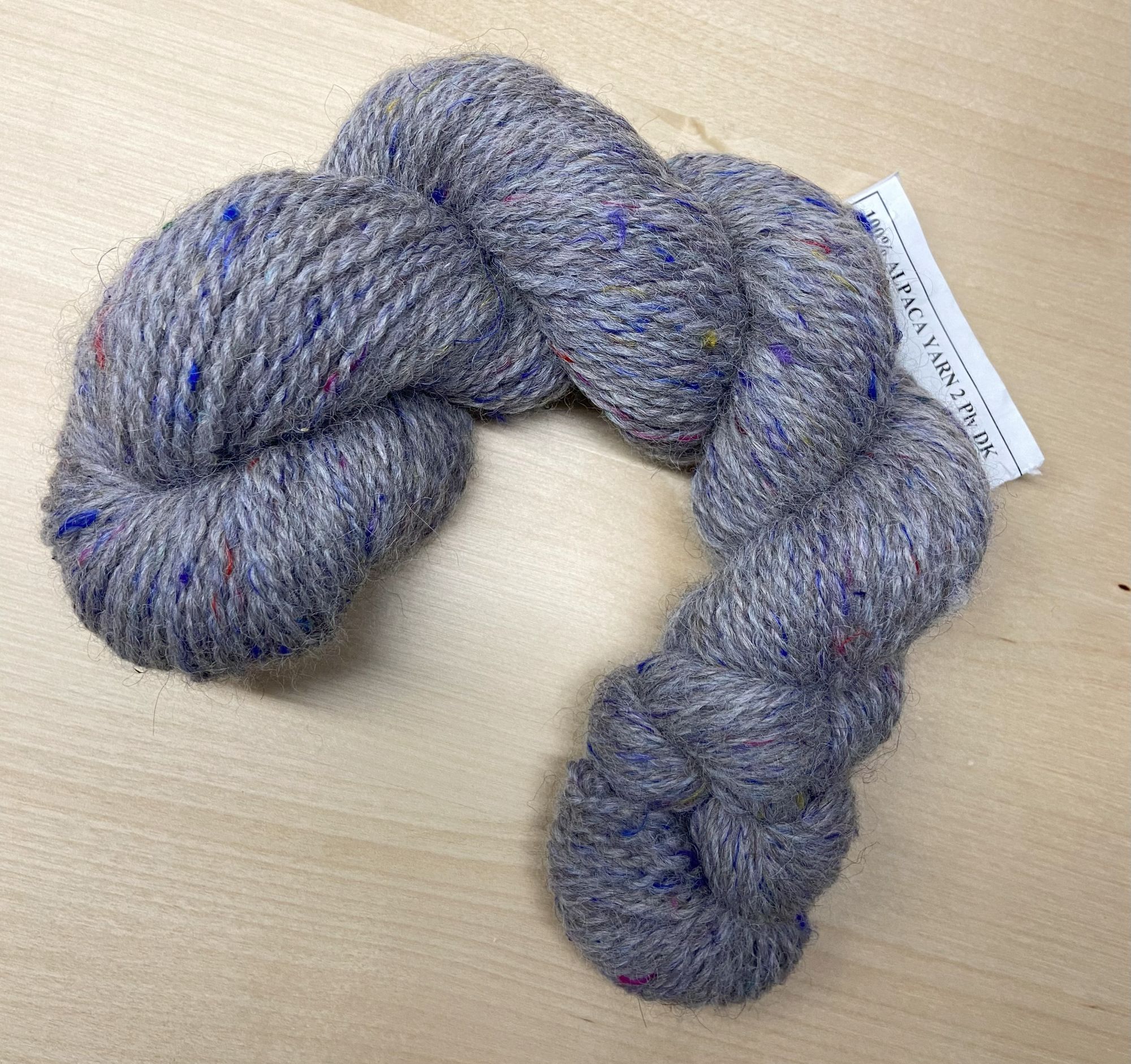 a skein of gray wool yarn
